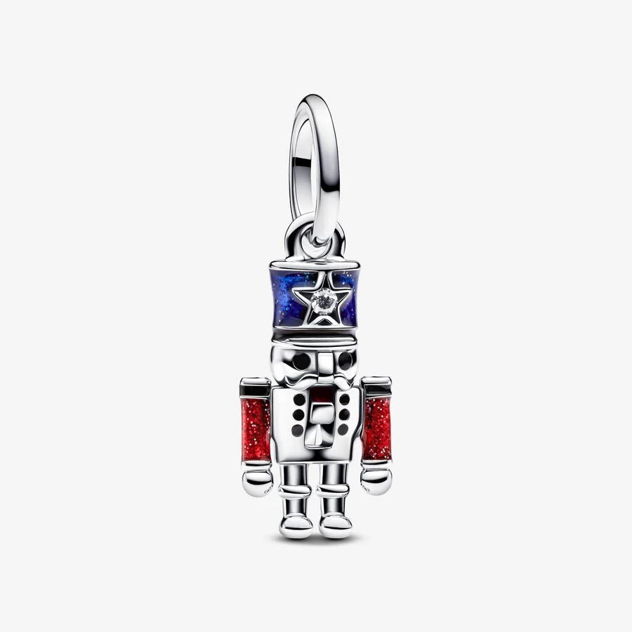 Moveable nutcracker sterling silver dangle with clear cubic zirconia, glittery blue, red and black enamel